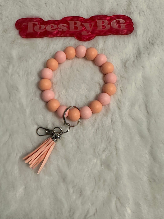 Peach Wristlet with silver hardware and tassel