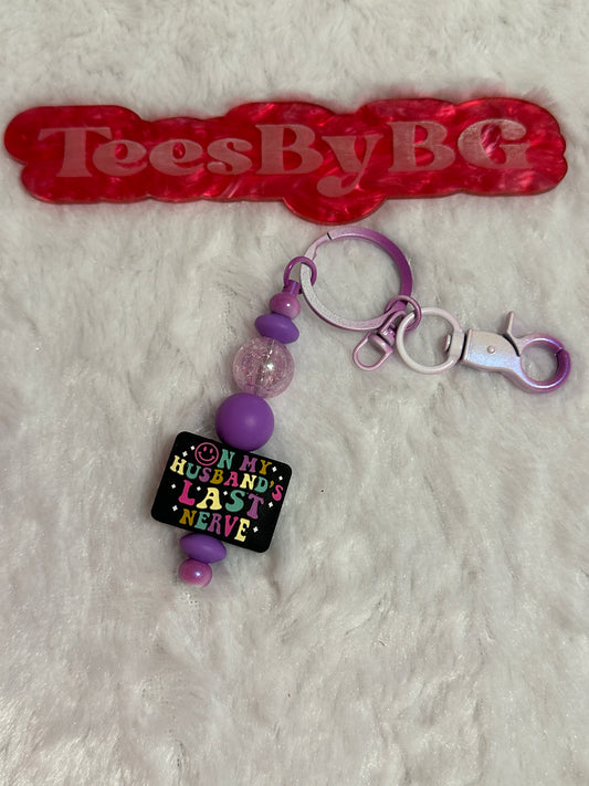 On My Husbands Last Nerve on Tie Dye Purple Keychain