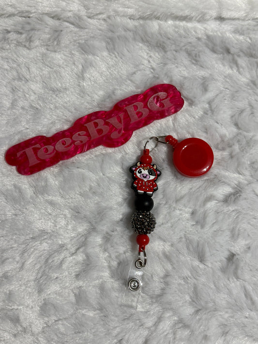 Red Hoodie Cow Badge Reel